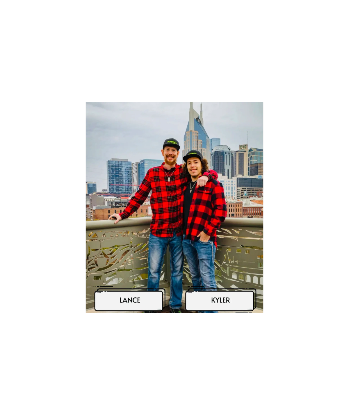 Paint Bro’z Inc. owners Lance and Kyler, two brothers in plaid jackets, with a city skyline behind them.